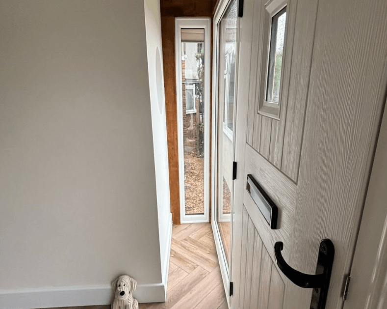 Bedroom with fitted wardrobes and an upholstered bed