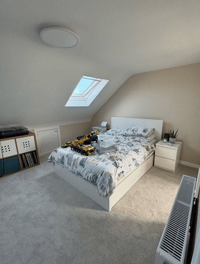 Dressing area with fitted wardrobes and a vanity with round mirrors