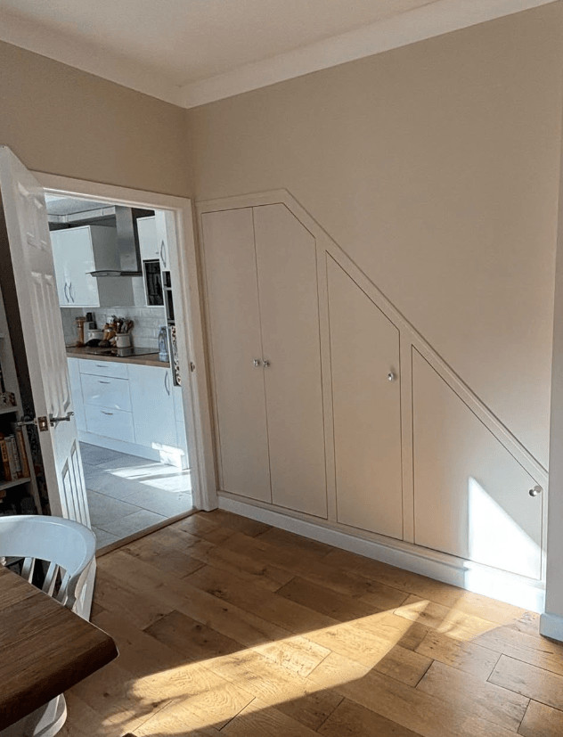 Bedroom with fitted mirrored wardrobes and a carpeted floor