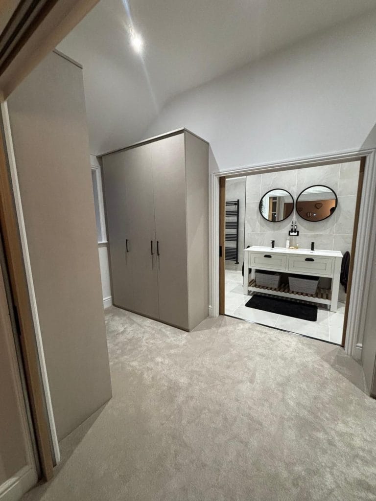 Bathroom with a bath, shower screen and tiled walls