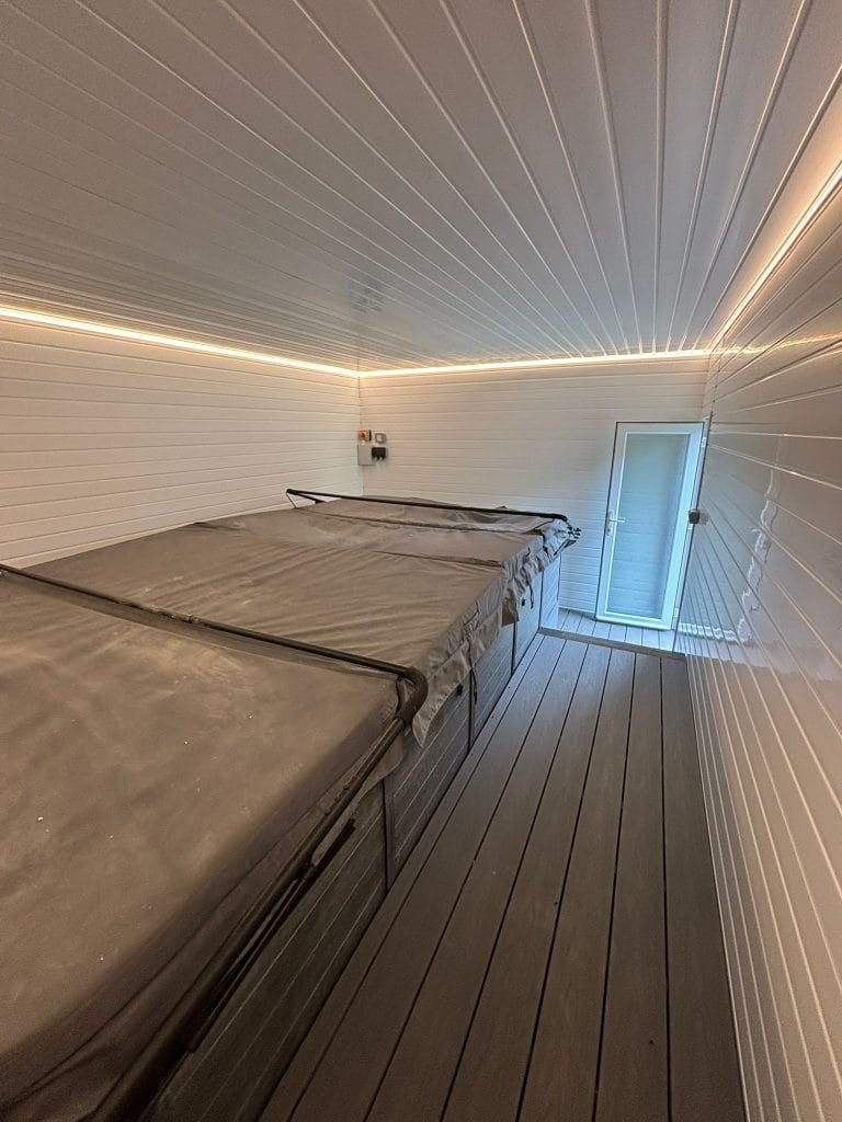 Loft bedroom with a dormer window and a view over rooftops
